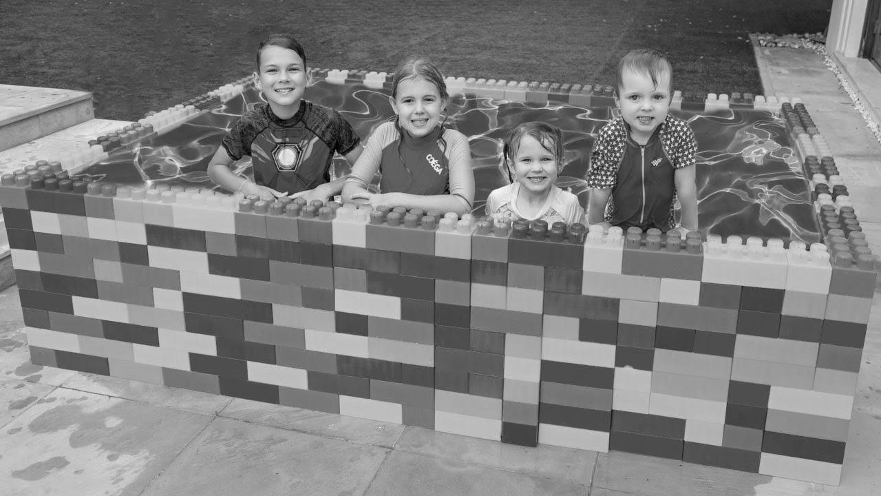 Five Youngsters Learn how to Swim within the Kids Pool and Performs with Fun Water Toys